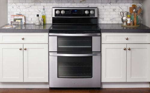 Whirlpool® range set in white cabinetry