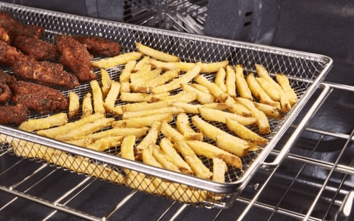 French fries in an air fryer basket