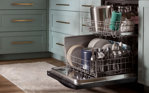 Open dishwasher in a brightly colored kitchen