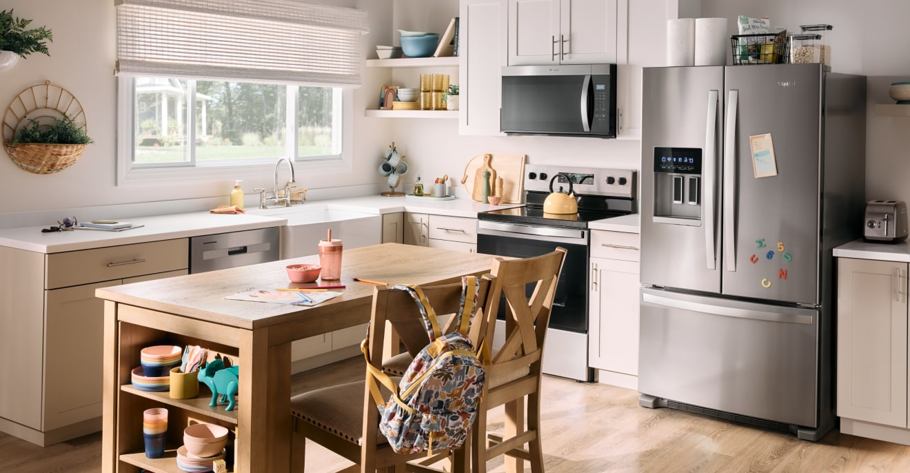 Laundry room with Whirlpool® appliances.