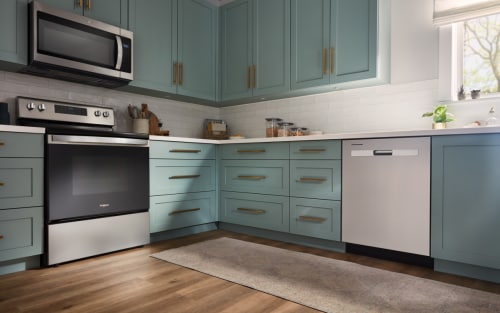 Whirlpool® electric range in a kitchen with teal cabinets