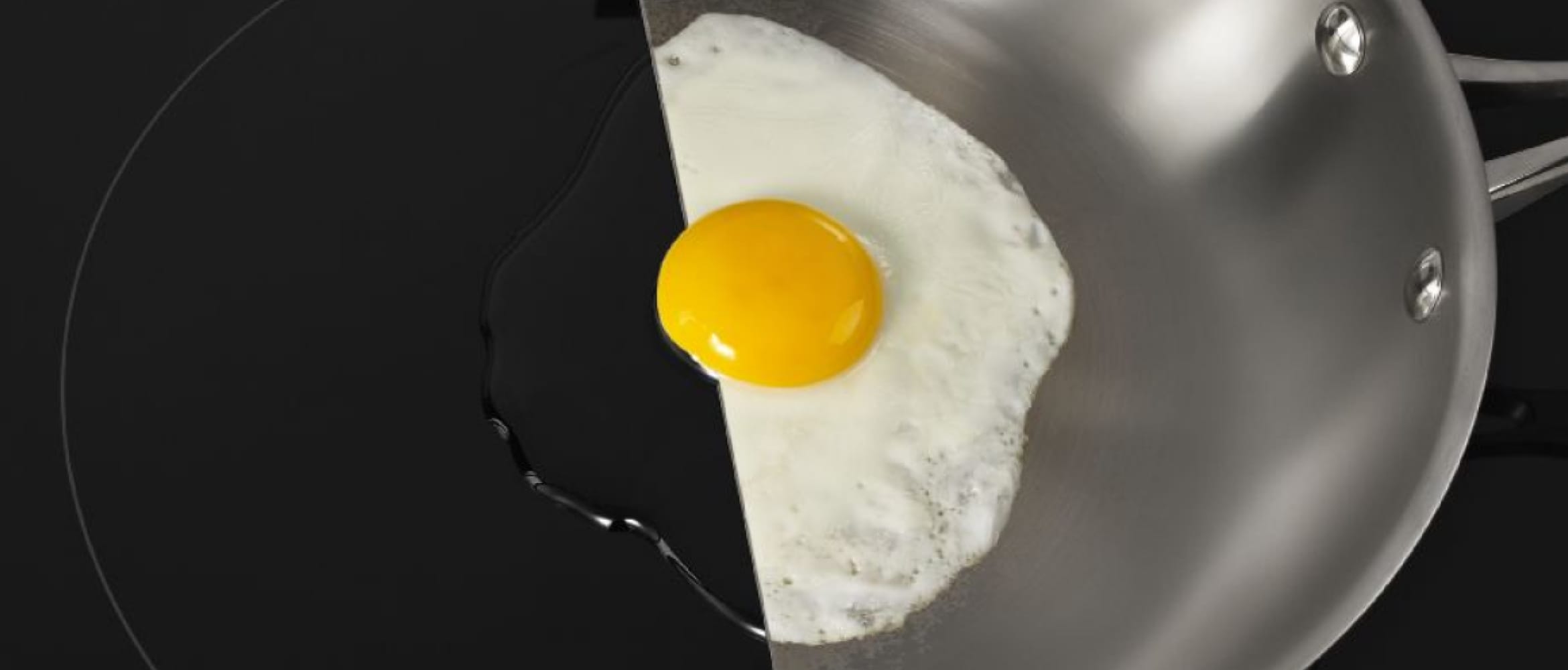 An egg simmering in a pan