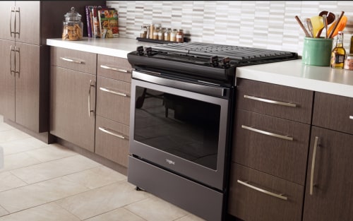 A gas range in a modern style kitchen