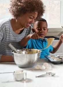 Woman and child cooking together