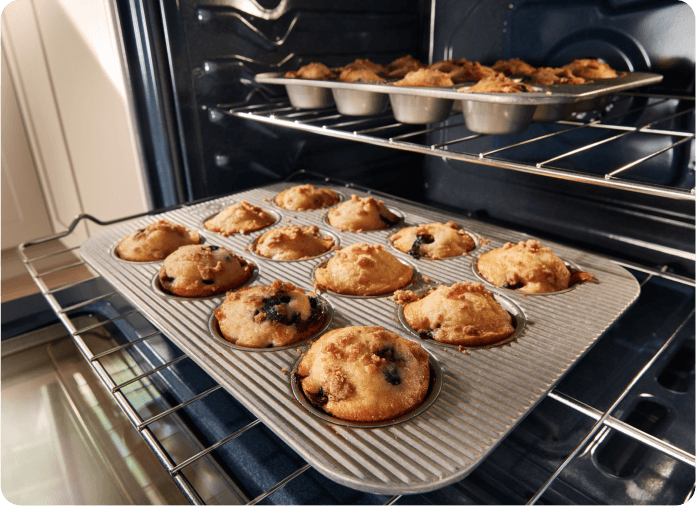 Muffins baking inside an oven