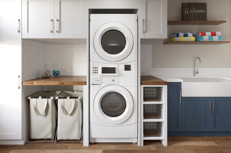 A stacked Whirlpool® laundry set in a laundry room.