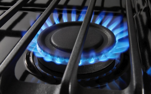 An activated burner on a gas range